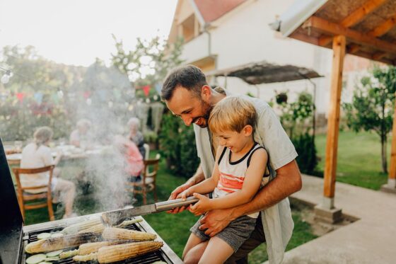 Father and son grilling